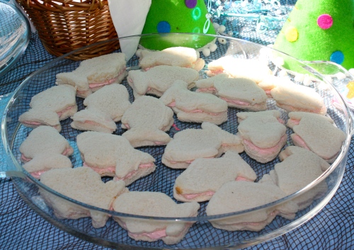 Cut out fish sandwiches filled with strawberry cream cheese.