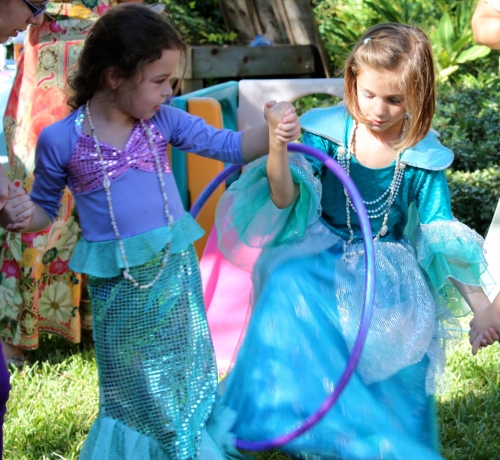 Have kids join hands to form a circle and pass a hula hoop around pretending it's a bubble under the sea.